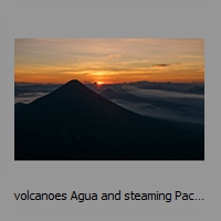 volcanoes Agua and steaming Pacaya at sunrise